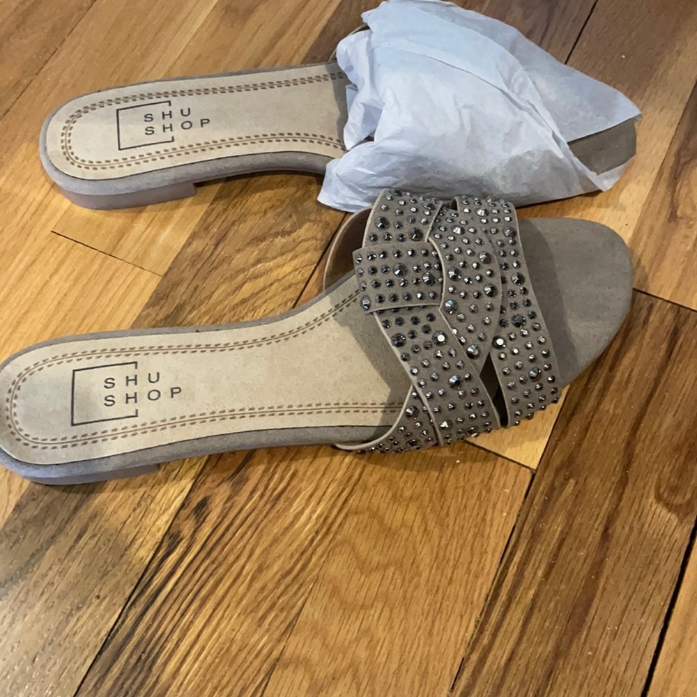 flat beige sandals with silver studs